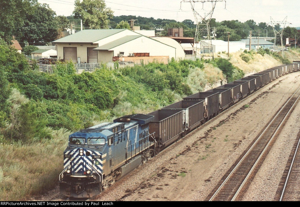 Coke empties roll west
